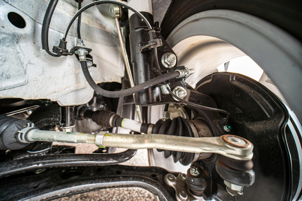 Worn suspension components leading to off-center steering wheel.